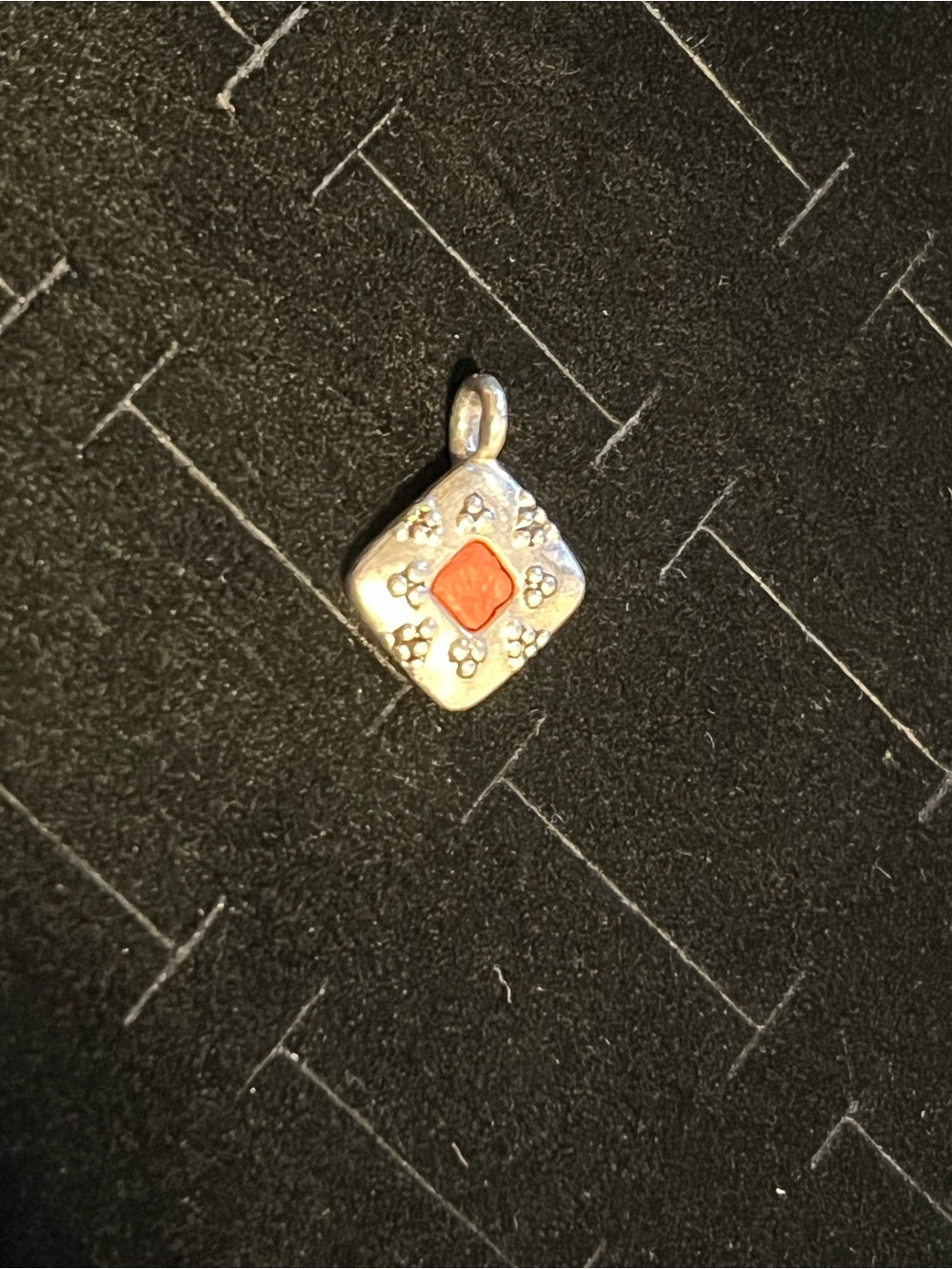 Silver toned orange stone pendant